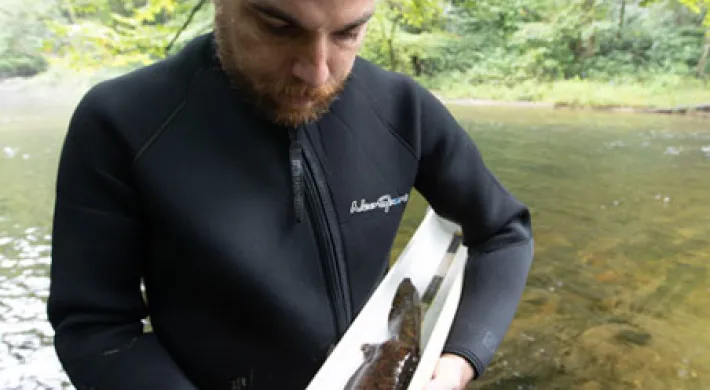 Dustin Smith with hellbender