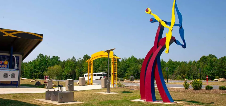 Spalazani's Generator, a kinetic steel sculpture, in front of the Zoo's Solar Pointe picnic area.