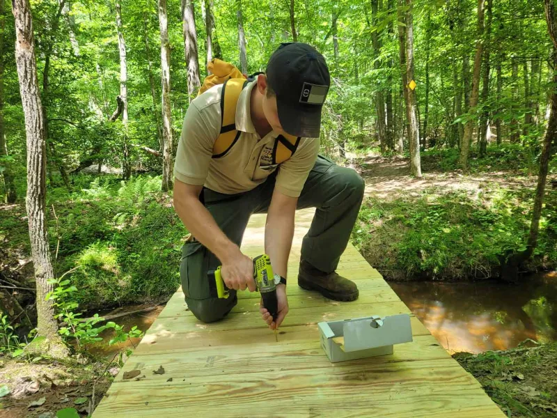 Drilling a screw in a newly constructed bridge