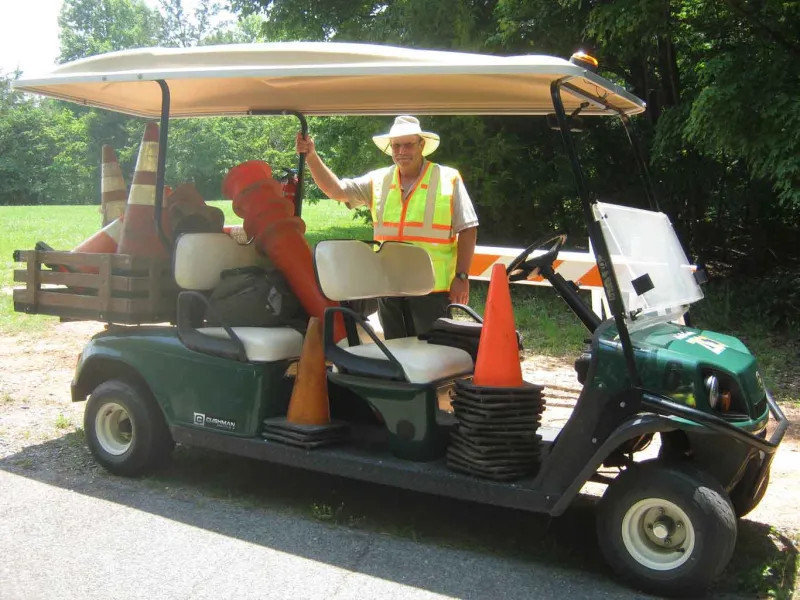 Ranger with traffic cones in golf cart