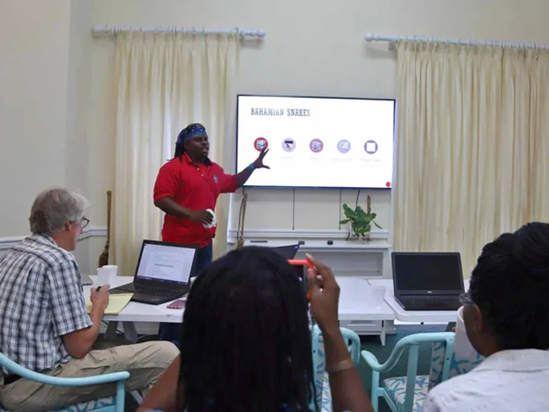 A Presenter at a joint meeting for boa conservation.